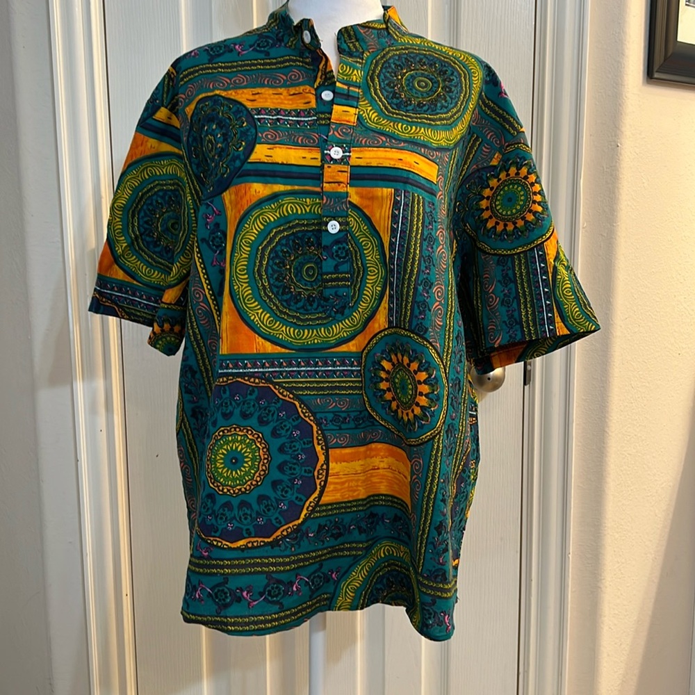 Men’s tribal shirt. Size 3X but it’s more like an XL-2X.